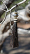 Close Up View  4 1/2" total length horsehair zipper pull with spring clip. Handmade  horsehair various colors and beading pattern. Black- Gold/RB/Gold