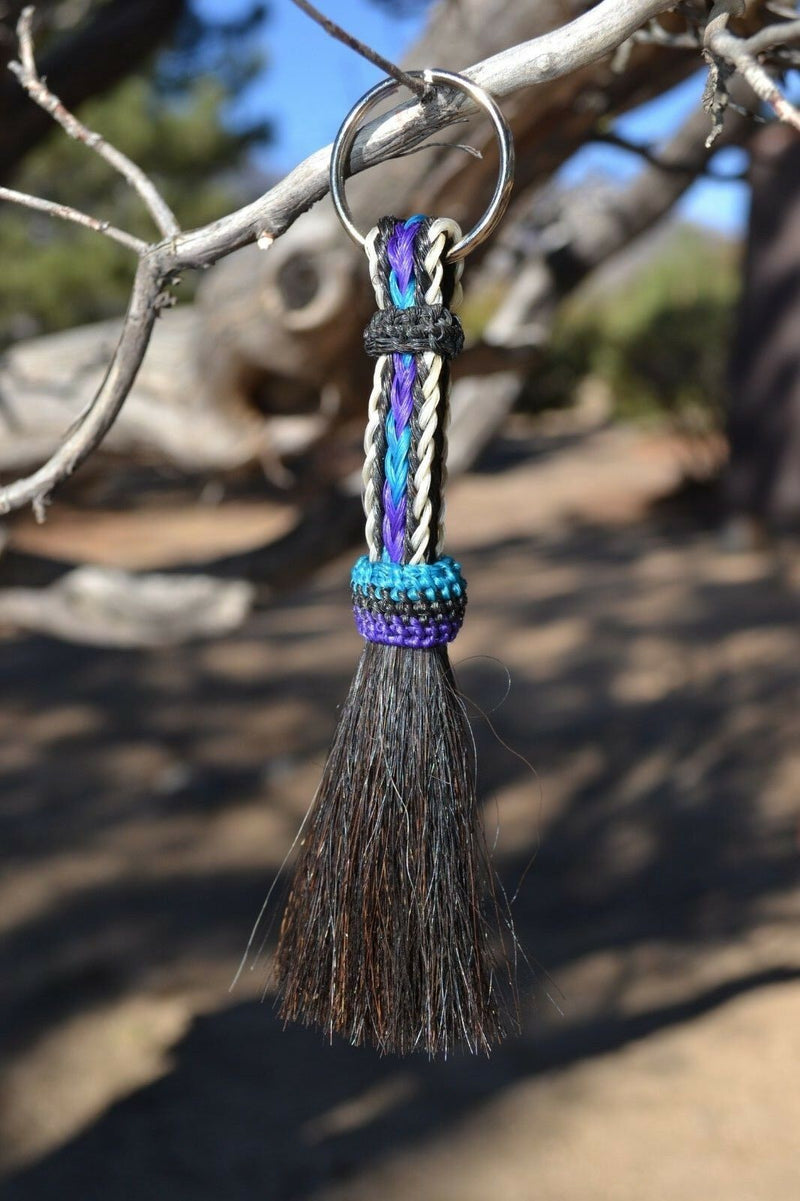 Close Up View 3/8" wide, 3 Strand Braided Horsehair Key Chain. This shorter style is 5 1/2" including the key ring.   White/Purple/Turquoise