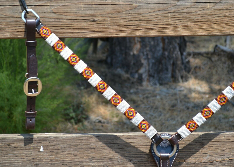 Circle Y of Yoakum - 1" Dark Oil Leather Breast Collar with Infinity Wrap Beading in a bright white, brown, gold and red southwest diamond pattern.  Stainless steel hardware.   12" adjustable tugs.