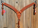 Reinsman Heavy Duty 2" Double Ply Contoured Breast Collar with Hand Carved with Snowflake Tooling.    Stainless steel hardware and tugs.   1" x 12" adjustable elastic tugs.   Mahogany color.