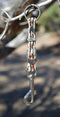 Close Up View Handmade natural horsehair braided key chain with silver tone faux buckle and snap. This key chain is about 6" long including the 1" key ring loop to connect the keys.    White/Rust/White