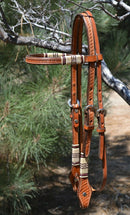 Jose Ortiz 5/8" Straight Browband Headstall.  Constructed of two-ply and stitched russet oil  finished leather.  Hand carved with Jose's signature basket weave tooling and natural hand braided rawhide with latigo brown details on cheek pieces and browband.  