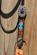 Close Up Buckle Circle Y of Yoakum -  2021 Hand Painted Blue Flower Browband Headstall.   Headstall is walnut with vintage background.    Horse sized, the crown measures 44" from bit end to bit end on the longest setting and adjustment to make up to 8" shorter.   