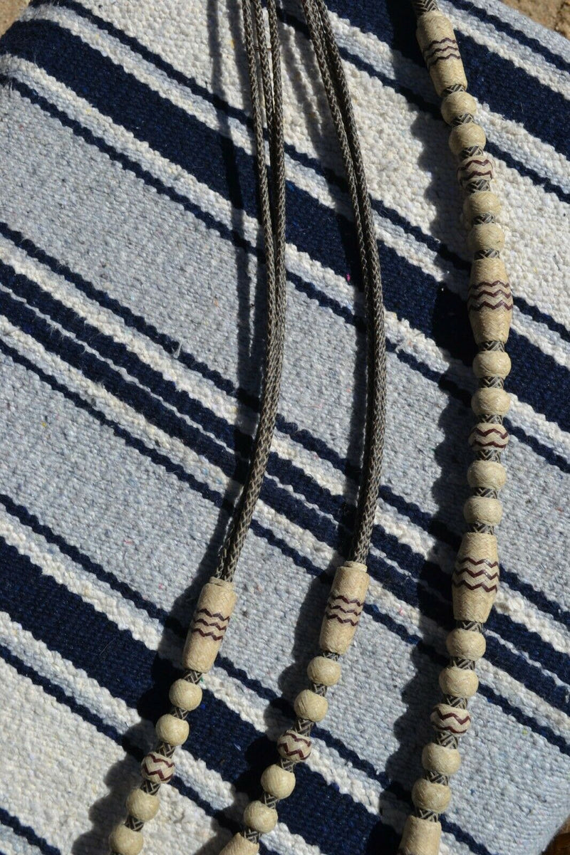 Beautiful Jose Ortiz Romel Reins, 18 plait Hand Braided Brown Beveled Rawhide braided in the 3 strand Santa Ynex style with round knots and long buttons. 