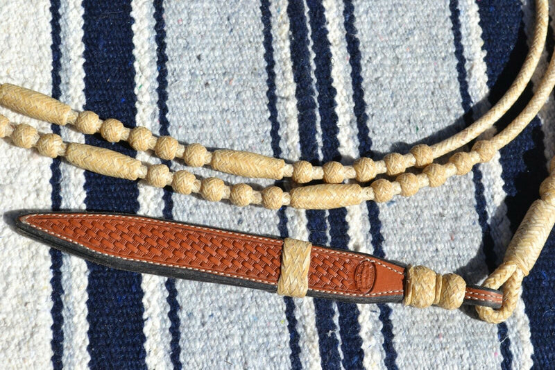 Close Up View Braided Rawhide and leather Popper. Beautiful Jose Ortiz Romel Reins, 12 plait Hand Braided Light Natural Variegated Rawhide braided in the Oklahoma style with round knots and long buttons