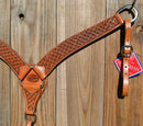 Reinsman Heavy Duty 2" Double Ply Contoured Breast Collar with Hand Carved with Waffle Box Tooling.    Stainless steel hardware and tugs.   1" x 12" adjustable elastic tugs.   Old West antiqued wash color.
