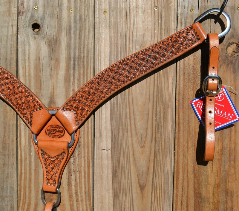 Reinsman Heavy Duty 2" Double Ply Contoured Breast Collar with Hand Carved with Waffle Box Tooling.    Stainless steel hardware and tugs.   1" x 12" adjustable elastic tugs.   Old West antiqued wash color.