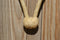 Close Up View Jose Oritz 1/2" hand braided light natural rawhide bosal with traditional round shaped knot with a spacer between the cheek pieces.  This bosal has 12 plait cheeks over a flexible all rawhide core.  
