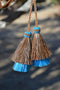 Super Close Up View natural horse hair Stampede String with two bell mule tail cut tassels and cotter pin attachments. 