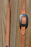 Close Up Antiqued Buckle. Jose Ortiz 1" One/Single Split Ear Headstall.  Constructed of single-ply natural harness leather with turquoise blue leather buckstitched by hand. 