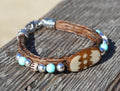 Close Up View Awesome 3/8" wide, 3 Strand Braided Horsehair Bracelet with a lobster claw clasp and various colored and patterned bone beads. Sorrel/Turquoise