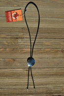 Western Style Black Braided Leather Bolo Tie with Southwestern Silver toned concho slide with matt black enamel inlay and silver tips.   