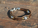 Close Up View Awesome 3/8" wide, 3 Strand Braided Horsehair Bracelet with a lobster claw clasp and various colored beads. Black/Chestnut/Silver/3B