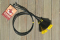 Close Up View natural horse hair Stampede String with two bell mule tail cut tassels and cotter pin attachments. Black/Black/Yellow