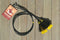 Close Up View natural horse hair Stampede String with two bell mule tail cut tassels and cotter pin attachments. Black/Black/Yellow