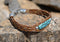 Close Up View Awesome 3/8" wide, 3 Strand Braided Horsehair Bracelet with a lobster claw clasp and various colored beads. Chestnut/Turquoise