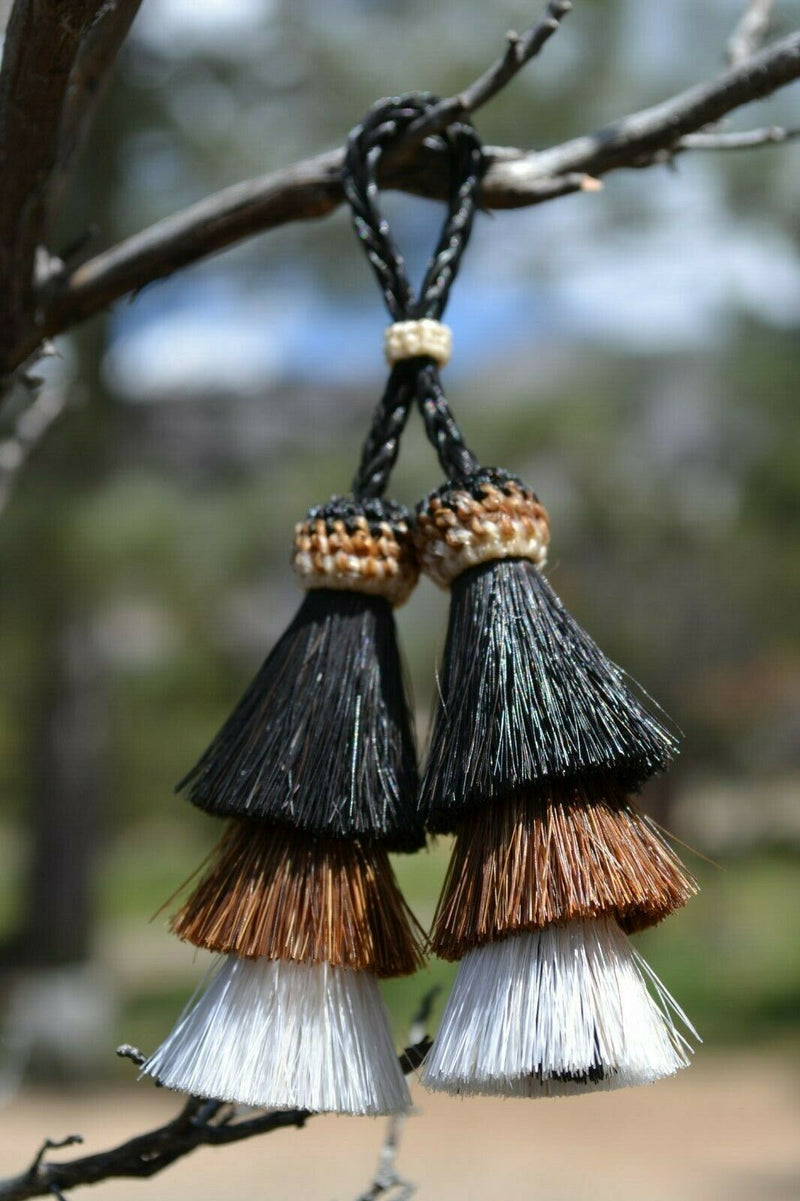 Close Up View 4" triple mule tail cut Double Tassels. Handmade horsehair dyed in bright colors as well as natural.     Black/Chestnut/White