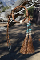 Close Up View  natural horse hair stampede string with beads and horse hair tassels and cotter pin attachments.   Chestnut- Turquoise/Silver/Turquoise