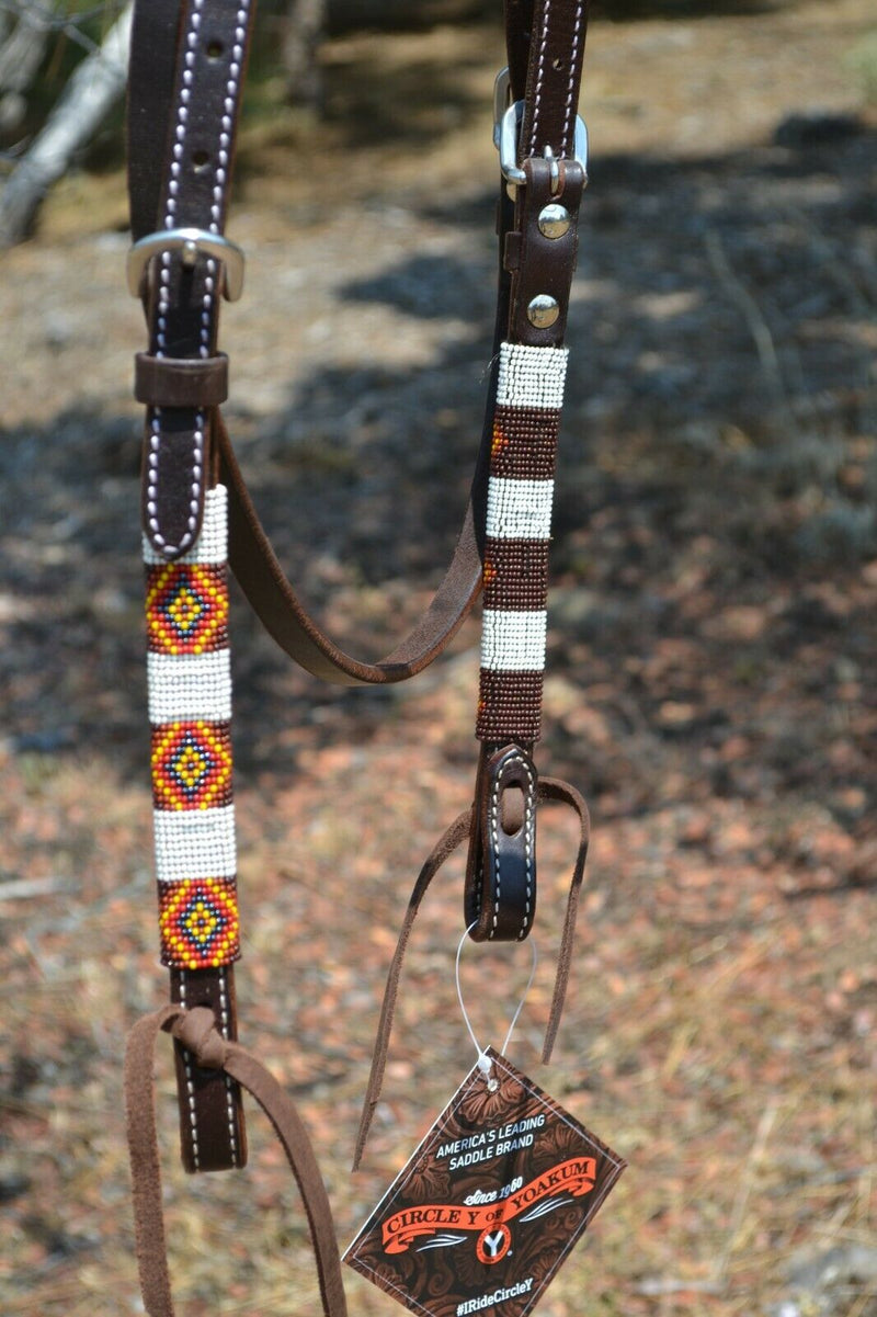 Close Up View Bit Ends Circle Y of Yoakum - Unique Infinity Wrap Browband Headstall with brown, red, yellow and white. Dark oil leather and replaceable buckles.  Ties at bit ends.