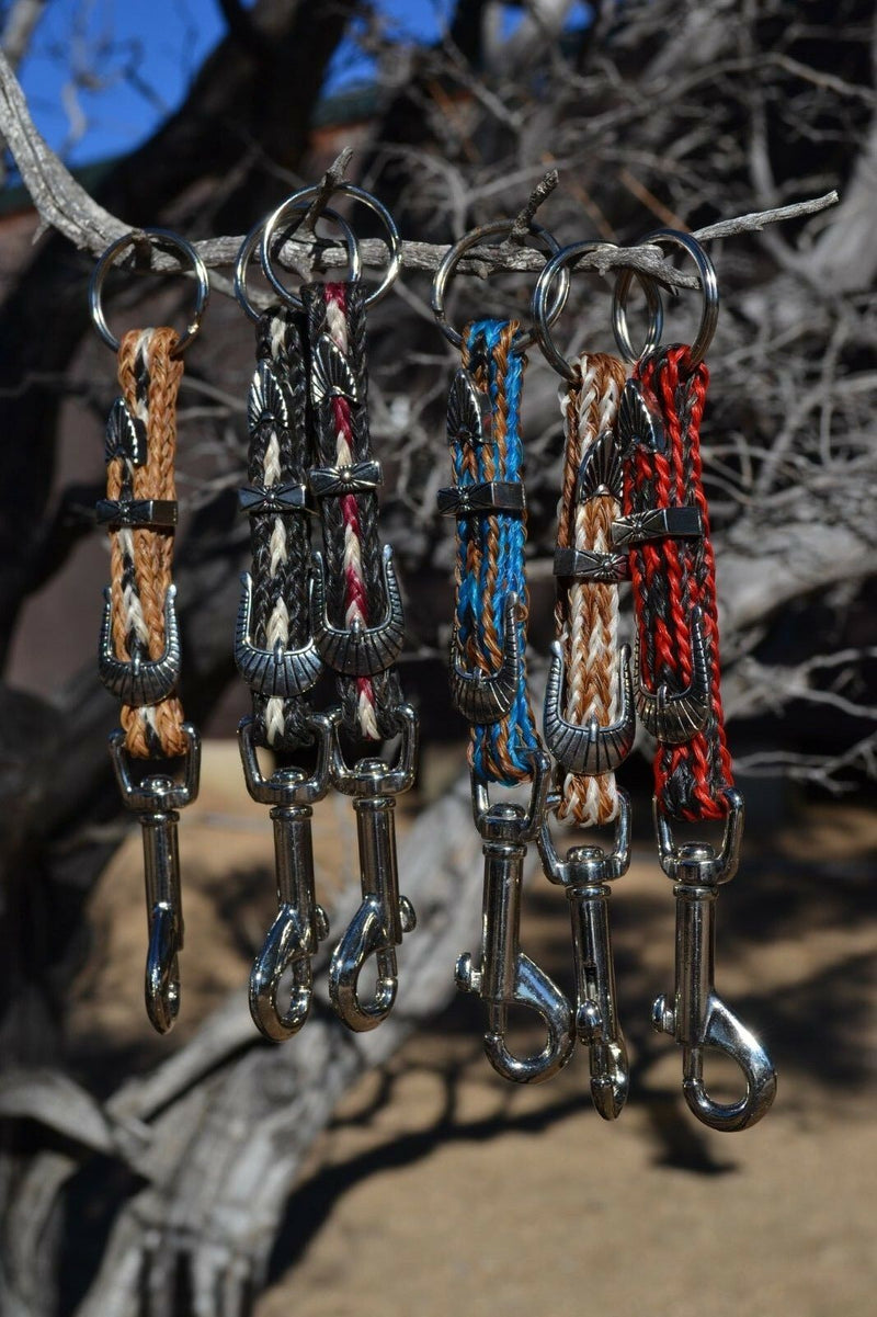 Close Up View Various Colors hand made natural horsehair braided key chain with silver tone faux buckle and snap. This key chain is about 6" long including the 1" key ring loop to connect the keys. 