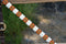 Close Up View Circle Y of Yoakum - 1" Dark Oil Leather Breast Collar with Infinity Wrap Beading in a bright white, brown, gold and red southwest diamond pattern.  Stainless steel hardware.   12" adjustable tugs.