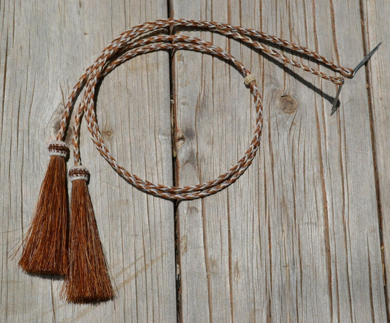Close Up View natural horse hair stampede string with cotter pin attachments. Sorrel/white/Sorrel