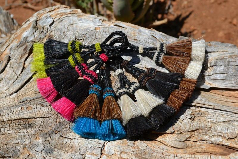 Close Up View Various Colors 2" Double two Bell mule tail cut natural and brightly colored tassels. Handmade from horsehair dyed in bright colors as well as natural.