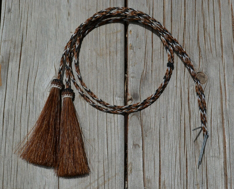 Close Up View natural horse hair stampede string with cotter pin attachments. Sorrel/Black/White/Sorrel