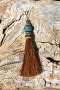 Close Up View 4 1/2" total length horsehair zipper pull with spring clip. Handmade horsehair various colors and beading pattern. Sorrel-Silver/RTQ/Silver