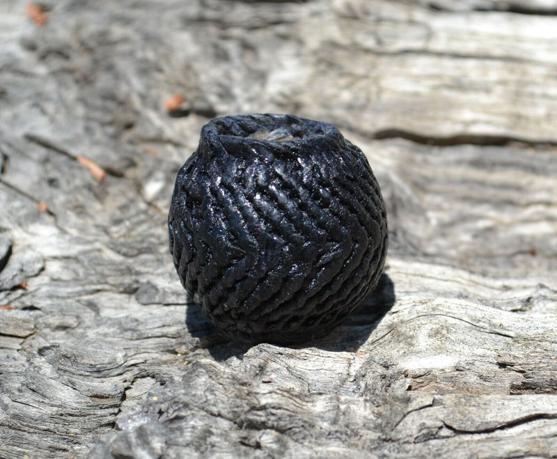  5/8" Hand Braided Natural Rawhide Wild Rag / Cowboy Scarf Slide.  Natural rawhide dyed black.  Smooth leather interior with 5/8" center hole, 1 1/4" in diameter and 1 1/4" high.
