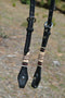 Close Up View Bit Ends and Rawhide Brading. Jose Ortiz 5/8" One Single Ear Headstall.  Constructed of two-ply and stitched black finished leather.  Hand carved with Jose's signature basket weave tooling and natural hand braided rawhide with burgundy latigo details on cheek pieces and ear pieces.   