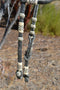 Jose Ortiz 5/8" Single One Ear Santa Maria Style Headstall.  Constructed of  12 plait black beveled rawhide with light natural rawhide details.  