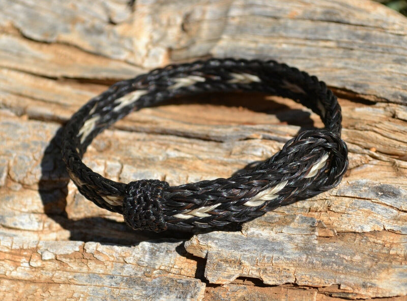 Awesome 1/2" wide, 3 Strand Braided Horsehair Bracelet with sliding knot.  The unique sliding knot XL design expands up to 10".  Unisex.  Very durable and makes a great gift for any horse lover. Black White