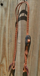 Jose Ortiz 3/4" One/Single Split Ear Headstall.  Constructed of single-ply natural harness leather with latigo leather buck stitching.   Removable antiqued copper color concho buckle and latigo ties the bit ends.  