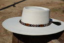 Beautiful 1/2" Hand Made Beaded Hatband with Long Bone Beads.  Made from 7 strands of black, brown and white beads and 1" wide amber color bone beads. 