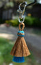 Close Up View 4.25" total length natural horsehair zipper pull with Larger Clasp. Handmade horsehair in the two bell mule tail style.     Chestnut/Turquoise