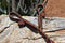 Close Up View Jose Ortiz handmade 1/2" latigo leather long tassel curb strap.  Tassel is 6" in length and attaches with self-tie bit attachments. 