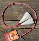 Close Up View natural horse hair stampede string with cotter pin attachments. Pink/White