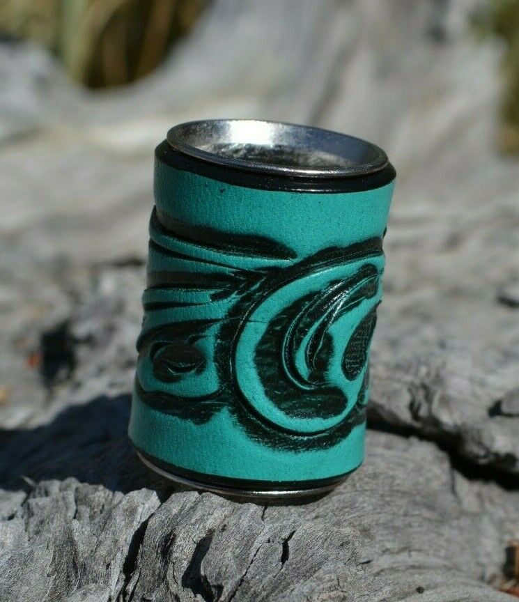 Turquoise - Brand new,  Western Style Hand Carved Floral Swirl Leather Scarf Slide.   Slide measures W 1" x  H 1 1/2" x D 7/8".  Smooth stainless steel inside will slide nicely over most fabrics without out snagging.     Available in a variety of colors.  