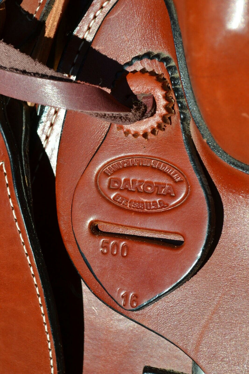 16" Dakota Roping Saddle with tan suede seat.   Includes flank set, martingale style breast collar, plain headstall and reins.  Full set ready to ride.  Smooth finish medium oil.  Square skirts.  