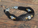 Close Up View Awesome 3/8" wide, 3 Strand Braided Horsehair Bracelet with a lobster claw clasp and various colored beads. Black/Silver/3B