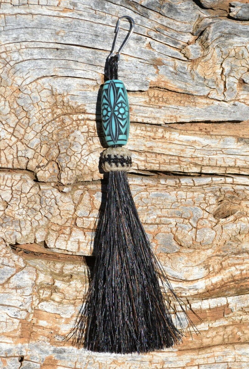 Close Up View 4 1/2" total length horsehair zipper pull with spring clip. Handmade horsehair various colors and beading pattern. Black-Turquoise