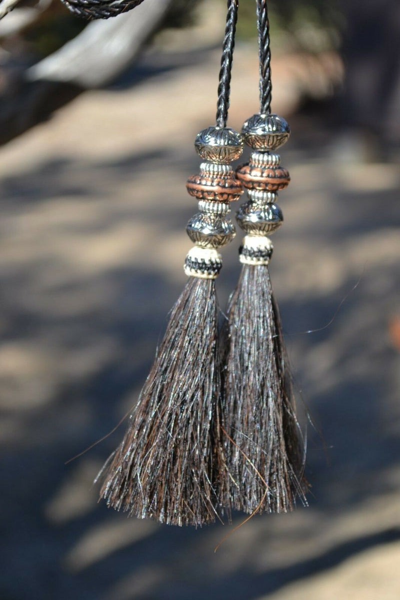 Super Close Up Detail View natural horse hair Stampede String with beads and horse hair tassels and cotter pin attachments.  Black-Silver/Copper/Silver