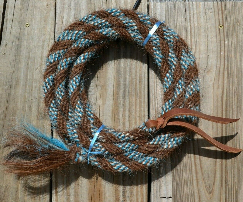 Hand made by Jose Ortiz, 5/8" x 22' mecate made from 6 tightly hand twisted (not machine twisted) strands of chestnut, white & turquoise  color mane hair with a soft leather popper at one end turks head knot on the other.  