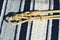 Close UP View Romel Connector. Beautiful Jose Ortiz Romel Reins, 12 plait Hand Braided Light Natural Variegated Rawhide braided in the Oklahoma style with round knots and long buttons