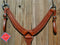 Reinsman Heavy Duty 2" Double Ply Leather Breast Collar with Hand Carved with Snake border tooling.  The chest pieces are swept upwards like a martingale style breast collar for less restrictive shoulder movement, however, it has standard tugs.  Medium honey color leather.  