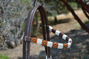 Close Up View Browband Circle Y of Yoakum - Unique Infinity Wrap Browband Headstall with brown, red, yellow and white. Dark oil leather and replaceable buckles.  Ties at bit ends.