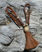 1/2" light russet oil leather curb strap with tightly braided natural rawhide knot and chestnut mane horsehair tassel.