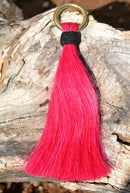 Close Up View 6" - brightly colored shu-fly tassels with 1" brass ring. Handmade from 100% natural mane horsehair dyed in bright colors.    Pink