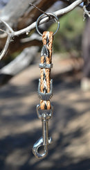 Close Up View Handmade natural horsehair braided key chain with silver tone faux buckle and snap. This key chain is about 6" long including the 1" key ring loop to connect the keys.   Sorrel/Black/White